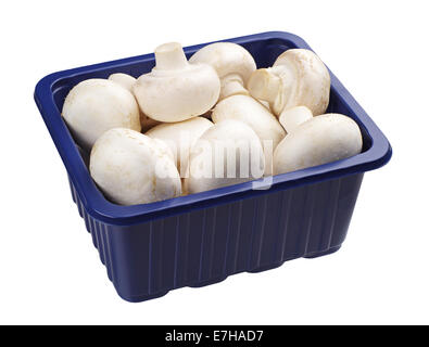 Champignons in a blue plastic packing isolated on white background Stock Photo