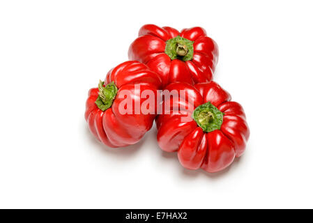 Three bell peppers from the kitchen garden, isolated on white background Stock Photo