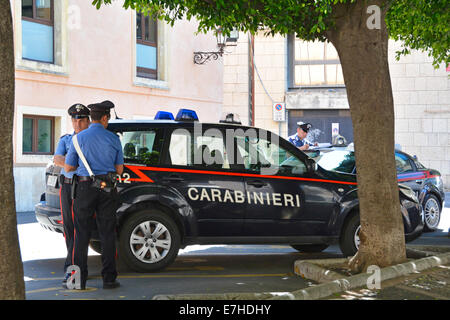 Carabinieri officers beside parked cars outside police station in Taormina Province of Messina Sicily Italy Stock Photo