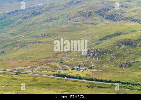 High view to Willie's Farm campsite beside the A5 road in Ogwen Valley from Carneddau mountains in Snowdonia National Park Wales Stock Photo