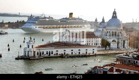 A Costa cruise ship leaves the harbour and passes close to Punta della Dogana with the church Santa Maria della Salute and the Piazza San Marco in Venice, Germany, 08 September 2014. A debate is currently going on about the passage of cruise ships this close to the city and the dangers for the environment this poses. The huge cruise ships are supposed to using the route close to Giudica in the future but rater the one closer to the train station, which is further from the city. Channels would have to be deepened and widened for this solution, however. Photo: Waltraud Grubitzsch -NO WIRE SERVIC