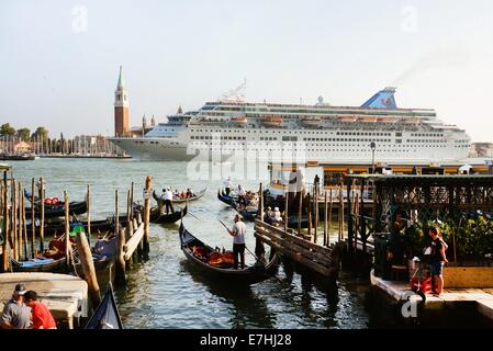 Venice, Germany. 08th Sep, 2014. The cruise ship Thomson Majesty leaves the harbour and passes close Piazza San Marco in Venice, Germany, 08 September 2014. A debate is currently going on about the passage of cruise ships this close to the city and the dangers for the environment this poses. The huge cruise ships are supposed to using the route close to Giudica in the future but rater the one closer to the train station, which is further from the city. Channels would have to be deepened and widened for this solution, however. Photo: Waltraud Grubitzsch -NO WIRE SERVICE-/dpa/Alamy Live News