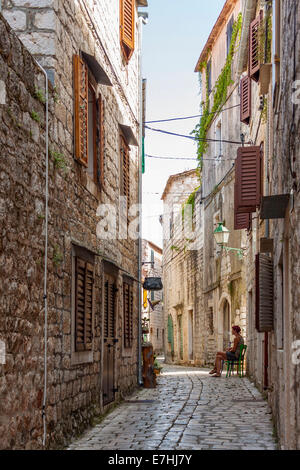 A narrow street in Stari Grad town at night on Hvar Island Stock Photo ...