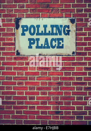 Retro Filtered Sign For An Election Polling Place Or Station On A Red Brick Wall Stock Photo