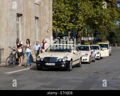 Line of official German taxis waiting at train station messe/deutz in Cologne, NRW, Germany Stock Photo