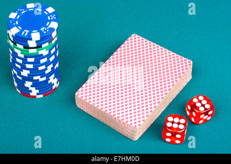 Cards, chips and dices for playing poker on the poker table Stock Photo