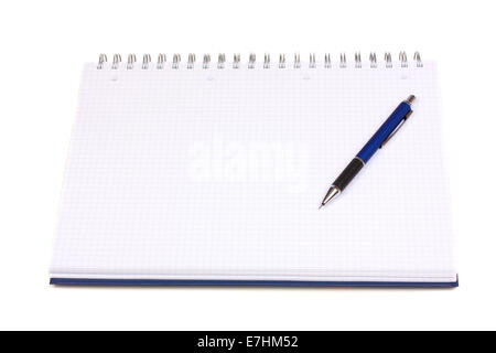Ring binding graph book and one pen on it over white background Stock Photo
