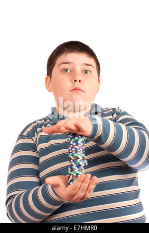 Young man with some poker chips isolated over white background Stock Photo