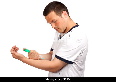 drug addict man with syringe in action, isolated over white background Stock Photo