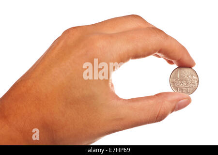 Hand with one old romania coin isolated over white background Stock Photo