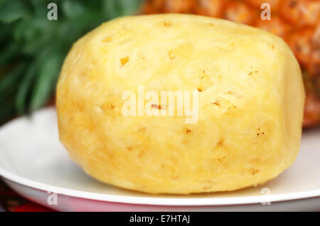 Peeled Pineapple on a plate Stock Photo