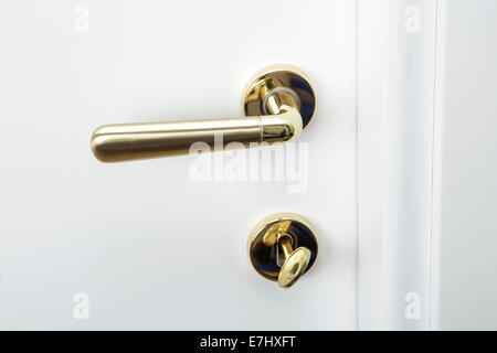 Door handle with lock on a white door Stock Photo