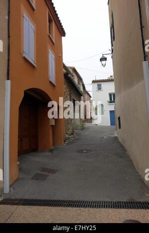 charming picturesque, pastel/sorbet colored houses with contrasting shutters, quaint, terracotta roofs with contrasting shutters Stock Photo