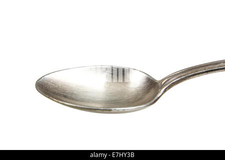 A silver spoon against a white background. Clipping path included for easy extraction. Stock Photo