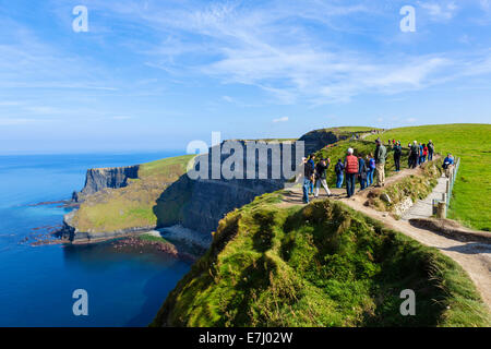 Tourists at the Cliffs of Moher, The Burren, County Clare, Republic of Ireland Stock Photo
