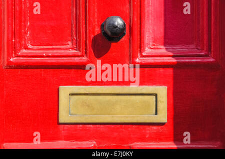 Red front door, London England United Kingdom UK Stock Photo