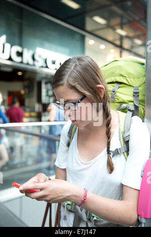 A traveller using a smart phone. Stock Photo