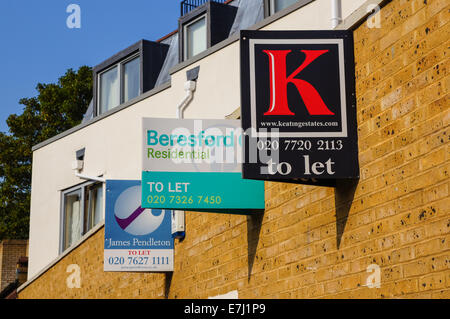 Real estate signs To Let outside modern terraced houses in South London England United Kingdom UK Stock Photo