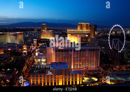 View of Las Vegas and High Roller giant ferris wheel at dusk, from Eiffel Tower replica at Paris Hotel and Casino, Las Vegas, Ne Stock Photo