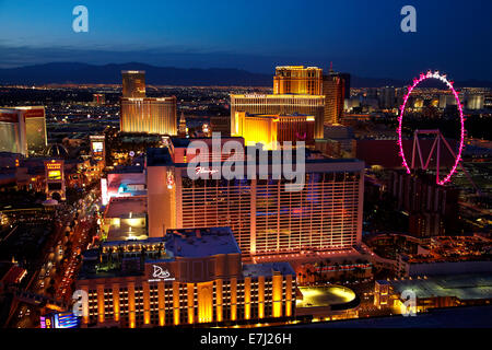 View of Las Vegas and High Roller giant ferris wheel at dusk, from Eiffel Tower replica at Paris Hotel and Casino, Las Vegas, Ne Stock Photo