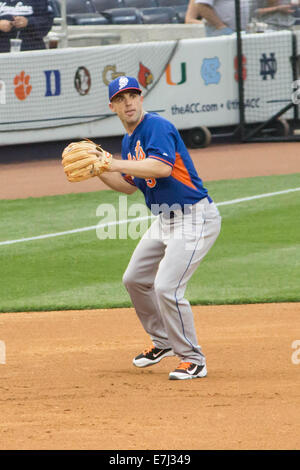 This image shows New York Mets third baseman and superstar David Wright throwing a ball toward first base during warm-ups Stock Photo