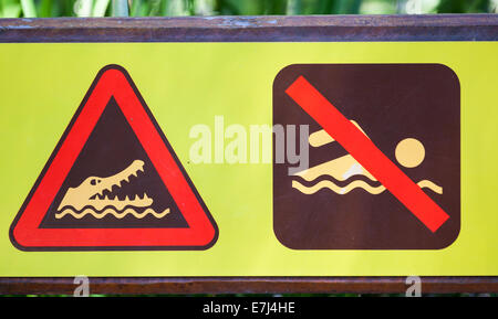 unique warning sign crocodiles in area don't go in water Stock Photo