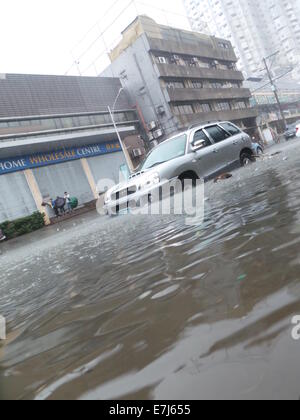 Quezon City, Philippines. 19th Sep, 2014. Typhoon Mario (international name: Typhoon Fung Wong) brought severe flooding in Quezon City Credit:  Sherbien Dacalanio/Alamy Live News Stock Photo