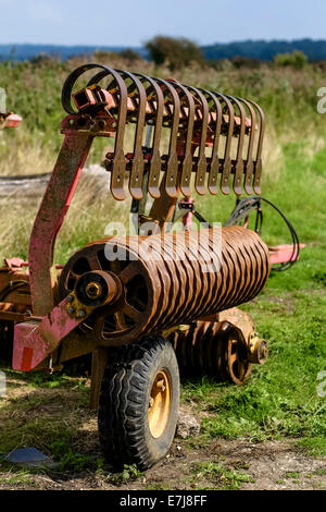 A rusty plough in corner of a West Sussex Field. Picture by Julie Edwards Stock Photo