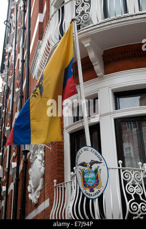 Julian assange arrested holding book