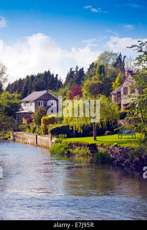 Attractive riverside properties on the banks of the River Clun at Leintwardine Herefordshire England  UK Stock Photo