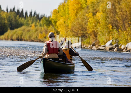 Men rowing a canoe, Tanana River, near Fairbanks, Alaska, USA Stock Photo