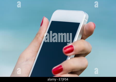 Woman Hand Holding White Smart Phone Similar To iPhone Stock Photo