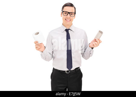 Man holding and empty and full toilet paper roll isolated on white background Stock Photo