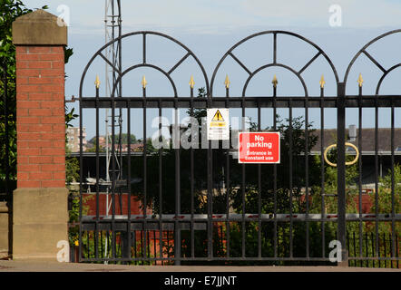 no parking notice in front of locked gates to offices and apartments in leeds yorkshire united kingdom Stock Photo