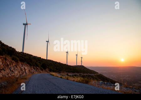 Beautiful Sunset with Wind Turbines Silhouettes Stock Photo