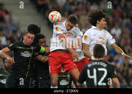 Salzburg, Austria. 18th Sep, 2014.Salzburg's Stefan Ilsanker (C) vies for the ball during the Europa League soccer match between Red Bull Salzburg vs FC Celtic Glasgow in Salzburg, Austria, 18 September 2014. Credit:  dpa picture alliance/Alamy Live News Stock Photo