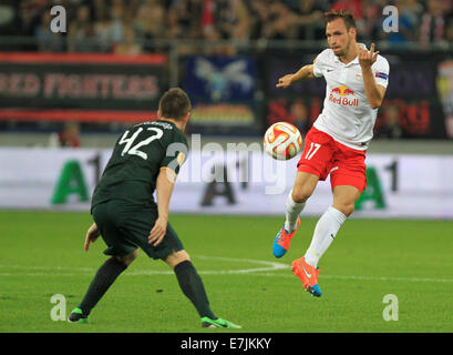 Salzburg, Austria. 18th Sep, 2014.Salzburg's Andreas Ulmer (r) vies for the ball with Celtic's Callum McGregor during the Europa League soccer match between Red Bull Salzburg vs FC Celtic Glasgow in Salzburg, Austria, 18 September 2014. Credit:  dpa picture alliance/Alamy Live News Stock Photo