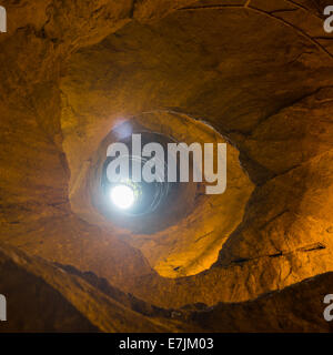 Mysterious dungeon- tunnel with walls made of stone Stock Photo