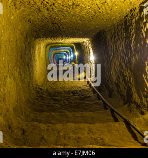 Mysterious dungeon- tunnel with walls made of stone Stock Photo