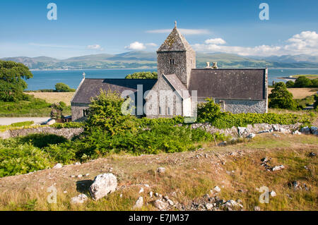 Penmon Priory and the Menai Straits, Near Beaumaris, Anglesey, North Wales, UK Stock Photo