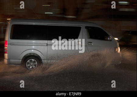 Makati City, Metro Manila, Philippines. 19 September, 2014. Philippine commuters try to get home in the evening rush hour, through the flooding caused by tropical storm 'Mario' (international name Fung-Wong) that hit the island of Luzon. Credit:  David Hodges/ Alamy Live News Stock Photo