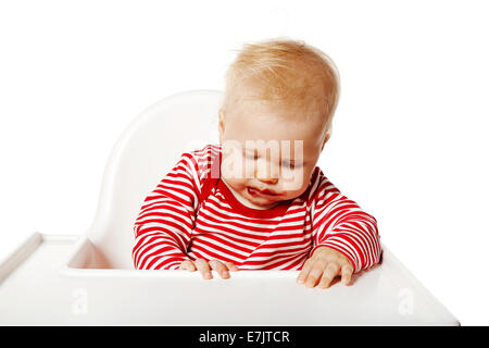 Portrait of baby tired after eating. Isolated on white background. Stock Photo