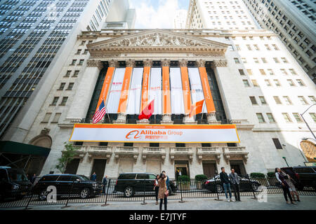 New York, USA. 19th Sep, 2014. Visitors outside the New York Stock Exchange decorated for the first day of trading for the Alibaba IPO on Friday, September 19, 2014. The mammoth e-cmmerce company from China goes public with what will possibly be the largest IPO ever. (© Richard B. Credit:  Richard Levine/Alamy Live News Stock Photo