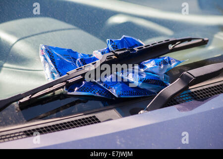 several parking tickets placed under car windscreen wipers for parking in illegal place at Bournemouth, Dorset UK in August Stock Photo