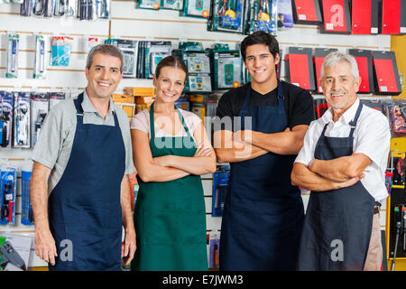 Confident Salespeople In Hardware Shop Stock Photo