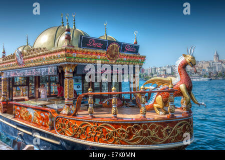 A balık-ekmek boat serving fish kebabs next to the Galata Bridge in Istanbul Stock Photo