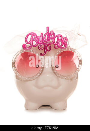 Pink piggy bank wearing glasses. Isolated on white Stock Photo - Alamy