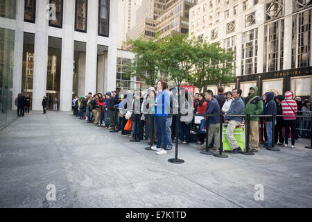 New York, USA. 19th September, 2014. Thousands of customers line up to enter the Apple store on Fifth Avenue in New York  to purchase the new iPhone 6 and 6 Plus on on the day of its release.  The new phones were introduced contain the new iOS 8 and the 6 Plus sports a large 5.5 inch display. Credit:  Richard Levine/Alamy Live News Stock Photo