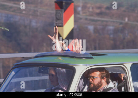 West Berlin, Germany. 17th Sep, 2013. Cars load of people from East Germany are greeted as they cross the Intra-German border near Hof, West Germany on Nov. 10, 1989. The borders between East and West Germany had been opened Nov. 9, 1989 for the first time in nearly 40 years.©1989 Scott A. Miller. © Scott A. Miller/ZUMA Wire/ZUMAPRESS.com/Alamy Live News Stock Photo