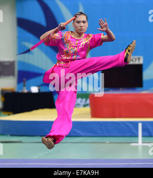 Incheon, South Korea. 20th Sep, 2014. Wei Hong of China performs during the women's nandao of Wushu competition at the 17th Asian Games in Incheon, South Korea, Sept. 20, 2014. Credit:  Xie Haining/Xinhua/Alamy Live News Stock Photo